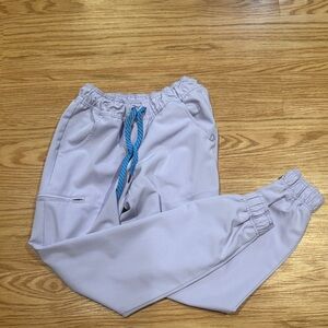 Lavender Jaanuu Scrub Joggers with Blue Drawstring